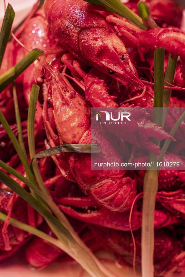 Crayfish are displayed at a barbecue stall at a night market in Nanning, China, on April 13, 2024. 