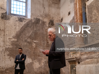 Poet Gabriele Tinti and director Abel Ferrara attend the ''Divine Echoes'' poems reading at Sant' Andrea De Scaphis in Rome, Italy, on Septe...