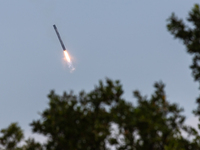 The first stage of the Falcon 9 rocket seconds before landing at complex LZ1 at the Cape Canaveral Space Station in Cape Canaveral, United S...