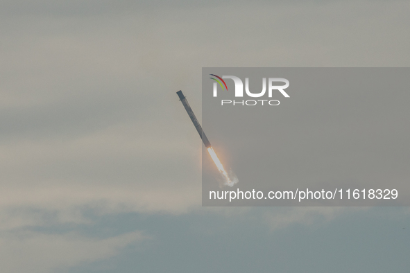 The first stage of the Falcon 9 rocket seconds before landing at complex LZ1 at the Cape Canaveral Space Station in Cape Canaveral, United S...