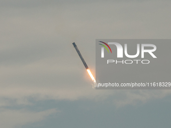 The first stage of the Falcon 9 rocket seconds before landing at complex LZ1 at the Cape Canaveral Space Station in Cape Canaveral, United S...