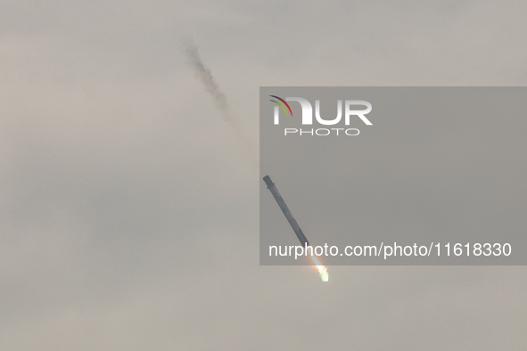 The first stage of the Falcon 9 rocket seconds before landing at complex LZ1 at the Cape Canaveral Space Station in Cape Canaveral, United S...