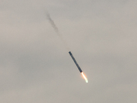 The first stage of the Falcon 9 rocket seconds before landing at complex LZ1 at the Cape Canaveral Space Station in Cape Canaveral, United S...