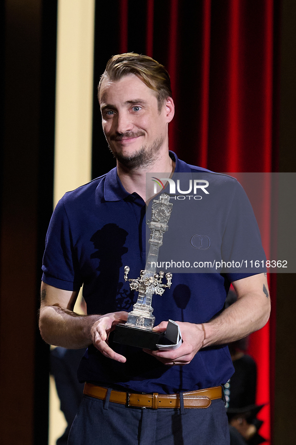 Francois Ozon receives the jury award for best script during the 72nd edition of the San Sebastian International Film Festival in San Sebast...