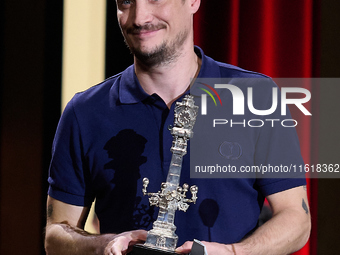 Francois Ozon receives the jury award for best script during the 72nd edition of the San Sebastian International Film Festival in San Sebast...