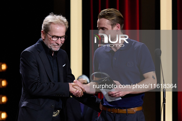 In San Sebastian, Spain, on September 28, 2024, actor Pierre Lottin receives the Silver Shell for Best Supporting Performance during the 72n...