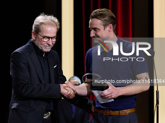 In San Sebastian, Spain, on September 28, 2024, actor Pierre Lottin receives the Silver Shell for Best Supporting Performance during the 72n...