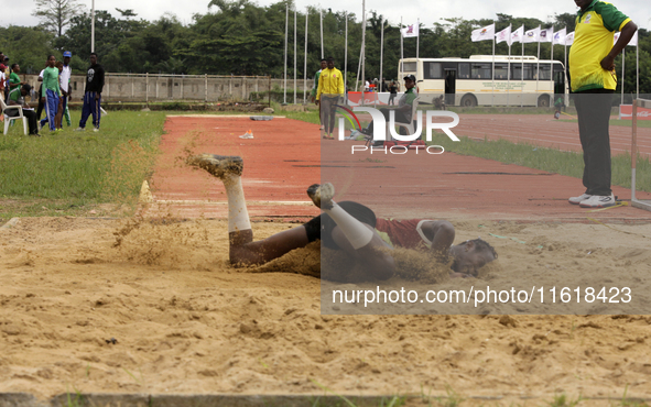 Success Udo-Gabriel of the University of Lagos, a bronze medallist in the triple jump, jumps during the final of the long jump, female categ...