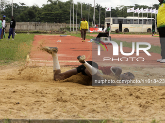 Success Udo-Gabriel of the University of Lagos, a bronze medallist in the triple jump, jumps during the final of the long jump, female categ...