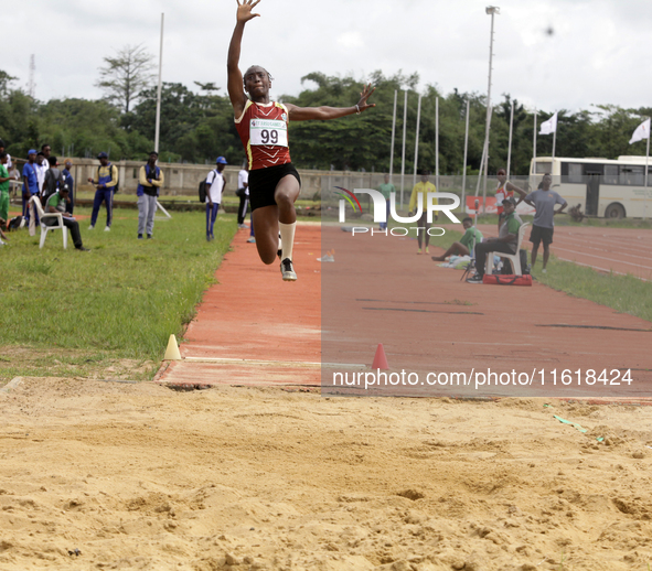 Success Udo-Gabriel of the University of Lagos, a bronze medallist in the triple jump, jumps during the final of the long jump, female categ...