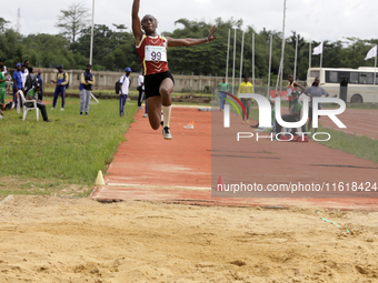 Success Udo-Gabriel of the University of Lagos, a bronze medallist in the triple jump, jumps during the final of the long jump, female categ...