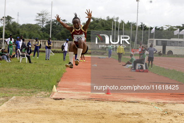 Success Udo-Gabriel of the University of Lagos, a bronze medallist in the triple jump, jumps during the final of the long jump, female categ...