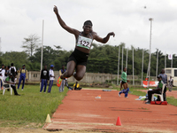 Polline Apiyo, a student from Gulu University in Uganda and a silver medallist in the triple jump female category, jumps during the final of...