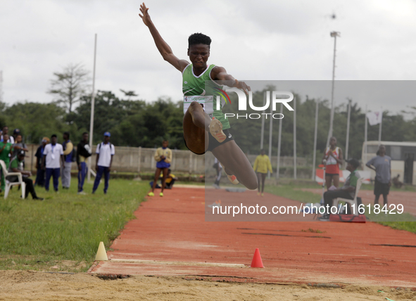 Adongo Celina of the University for Development Studies in Tamale, Ghana, gold medallist in the long jump female category, jumps during the...