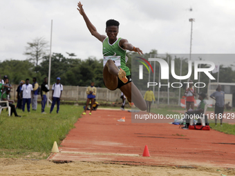 Adongo Celina of the University for Development Studies in Tamale, Ghana, gold medallist in the long jump female category, jumps during the...