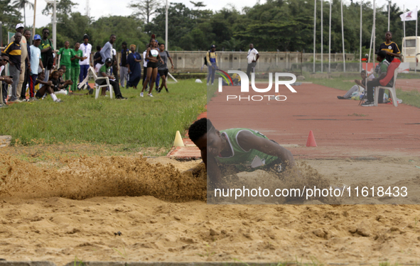 Adongo Celina of the University for Development Studies in Tamale, Ghana, gold medallist in the long jump female category, jumps during the...