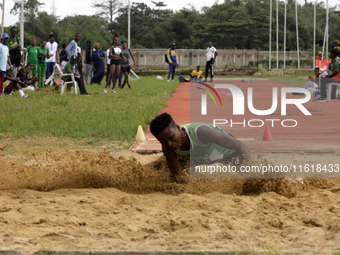 Adongo Celina of the University for Development Studies in Tamale, Ghana, gold medallist in the long jump female category, jumps during the...