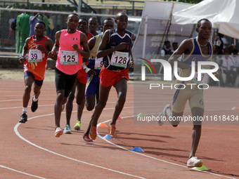 Men compete during the 5000m race final at the 11th All Africa University Games held at the University of Lagos, Akoka in Lagos, Nigeria, on...