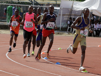 Men compete during the 5000m race final at the 11th All Africa University Games held at the University of Lagos, Akoka in Lagos, Nigeria, on...