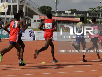 Men compete during the 5000m race final at the 11th All Africa University Games held at the University of Lagos, Akoka in Lagos, Nigeria, on...