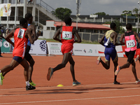 Men compete during the 5000m race final at the 11th All Africa University Games held at the University of Lagos, Akoka in Lagos, Nigeria, on...