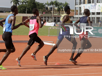 Men compete during the 5000m race final at the 11th All Africa University Games held at the University of Lagos, Akoka in Lagos, Nigeria, on...