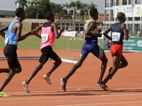 Men compete during the 5000m race final at the 11th All Africa University Games held at the University of Lagos, Akoka in Lagos, Nigeria, on...