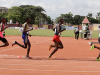 Men compete during the 5000m race final at the 11th All Africa University Games held at the University of Lagos, Akoka in Lagos, Nigeria, on...