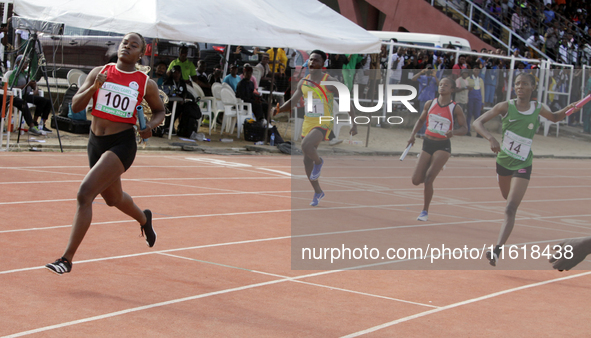 Athletes compete during the 4x400m mixed relay race final at the 11th All Africa University Games held at the University of Lagos, Akoka in...