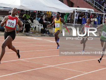 Athletes compete during the 4x400m mixed relay race final at the 11th All Africa University Games held at the University of Lagos, Akoka in...