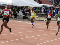 Athletes compete during the 4x400m mixed relay race final at the 11th All Africa University Games held at the University of Lagos, Akoka in...