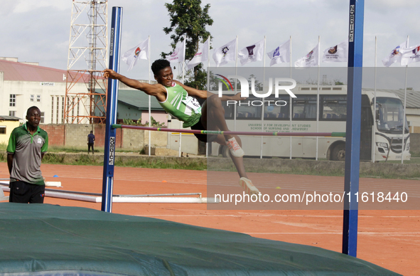 Adongo Celina of the University for Development Studies in Tamale, Ghana, scales the bar in the high jump female category during the 11th Al...