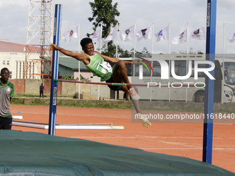 Adongo Celina of the University for Development Studies in Tamale, Ghana, scales the bar in the high jump female category during the 11th Al...