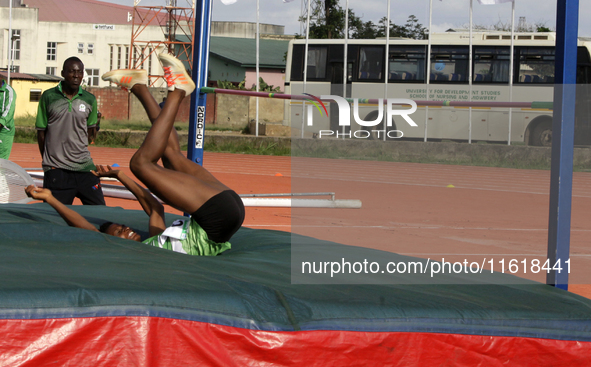 Adongo Celina of the University for Development Studies, Tamale, Ghana, gold medallist in the high jump female category, scales the bar duri...