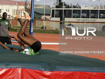 Adongo Celina of the University for Development Studies, Tamale, Ghana, gold medallist in the high jump female category, scales the bar duri...