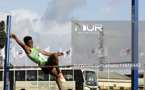 Adongo Celina of the University for Development Studies in Tamale, Ghana, scales the bar in the high jump female category during the 11th Al...