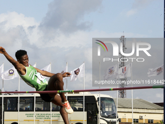 Adongo Celina of the University for Development Studies in Tamale, Ghana, scales the bar in the high jump female category during the 11th Al...