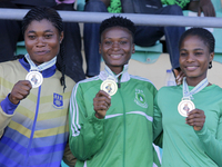 L-R: Agnes Adwoa Adjei of the University of Ghana, silver medallist in the female long jump; Adongo Celina of the University for Development...