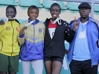 L-R: Polline Apiyo, student from Gulu University, Uganda, silver medallist, triple jump in the female category; Adwoa Adjei of the Universit...