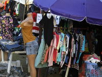 Sellers display sportswear and souvenirs during the 11th All Africa University Games at the University of Lagos, Akoka in Lagos, Nigeria, on...