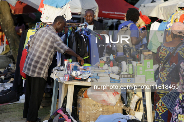 Sellers display sportswear and souvenirs during the 11th All Africa University Games at the University of Lagos, Akoka in Lagos, Nigeria, on...