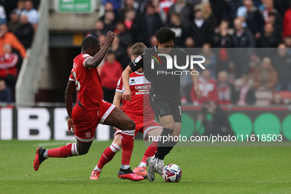 Stoke City's Bae Jun-Ho is in action with Middlesbrough's Anfernee Dijksteel during the Sky Bet Championship match between Middlesbrough and...