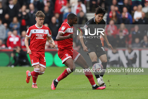 Stoke City's Bae Jun-Ho is in action with Middlesbrough's Anfernee Dijksteel during the Sky Bet Championship match between Middlesbrough and...