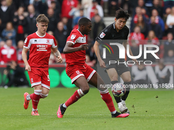 Stoke City's Bae Jun-Ho is in action with Middlesbrough's Anfernee Dijksteel during the Sky Bet Championship match between Middlesbrough and...