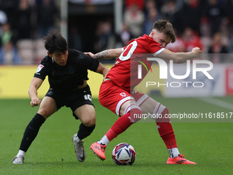 Bae Jun-Ho of Stoke City is in action against Middlesbrough's Ben Doak during the Sky Bet Championship match between Middlesbrough and Stoke...