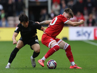 Bae Jun-Ho of Stoke City is in action against Middlesbrough's Ben Doak during the Sky Bet Championship match between Middlesbrough and Stoke...