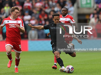 Stoke City's Million Manhoef is in action with Middlesbrough's Aidan Morris during the Sky Bet Championship match between Middlesbrough and...