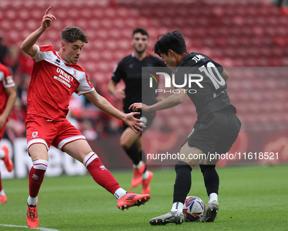 Bae Jun-Ho of Stoke City is in action with Middlesbrough's Hayden Hackney during the Sky Bet Championship match between Middlesbrough and St...