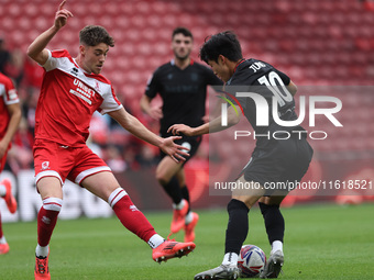 Bae Jun-Ho of Stoke City is in action with Middlesbrough's Hayden Hackney during the Sky Bet Championship match between Middlesbrough and St...