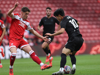 Bae Jun-Ho of Stoke City is in action with Middlesbrough's Hayden Hackney during the Sky Bet Championship match between Middlesbrough and St...